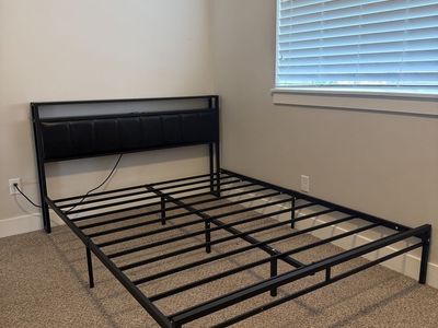 Queen black metal bed frame with storage and LED strip in headboard