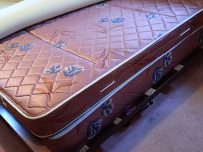 full size bed frame with mattress, box spring, and foam topper set.