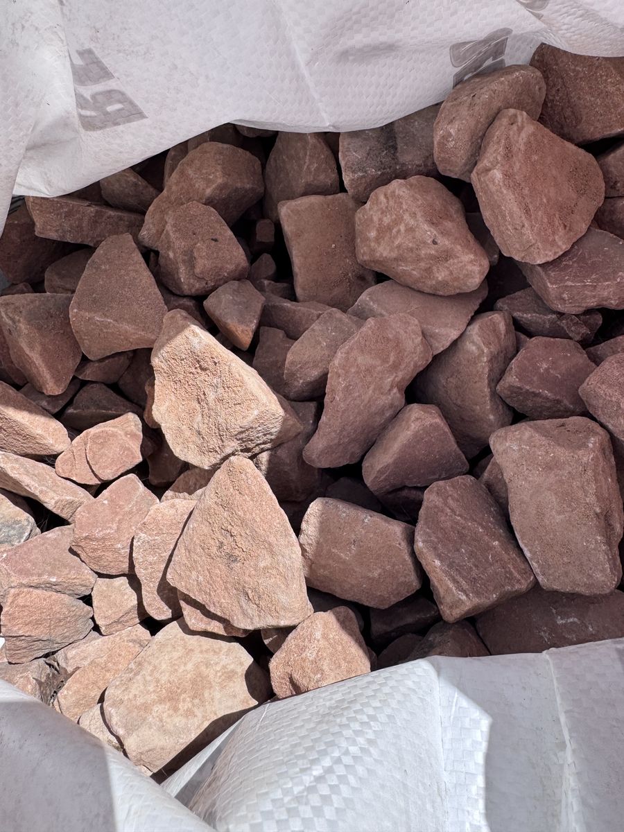 Bagged landscaping red rock