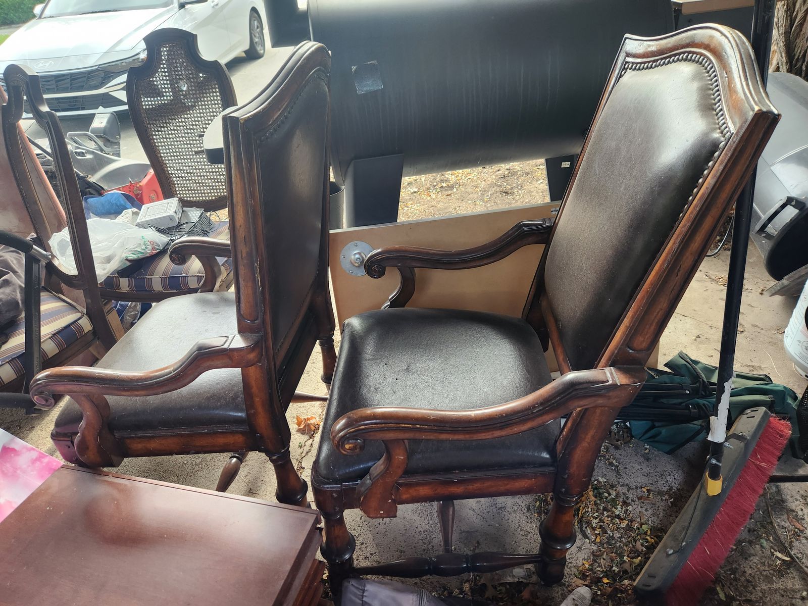 Two leather captain chairs