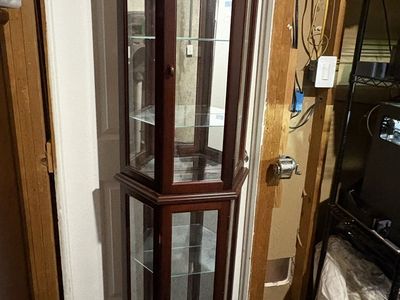 Reddish brown curio cabinet