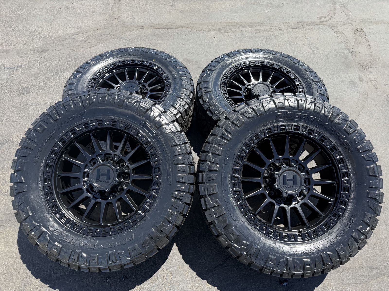 4 new 35x12.50r20 Nitto Ridge Grappler Hostile H137 Black 8x170 Ford F250 F350 Superduty wheels and tires powerstroke 8 lug