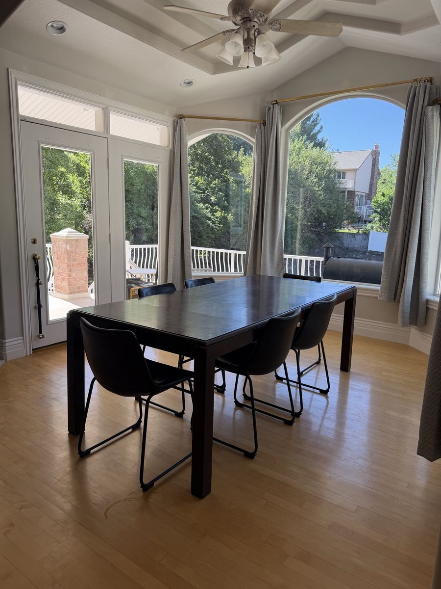 Modern Dark Wood Dining Table - Seats 6-8, Extendable Leaf, Includes 6 Black Chairs