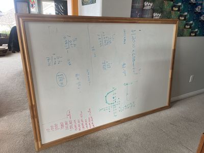 4' by 6' white board with wooden frame