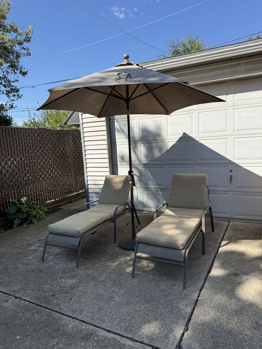Patio furniture, 2 loungers with cushions and umbrella with weighted stand