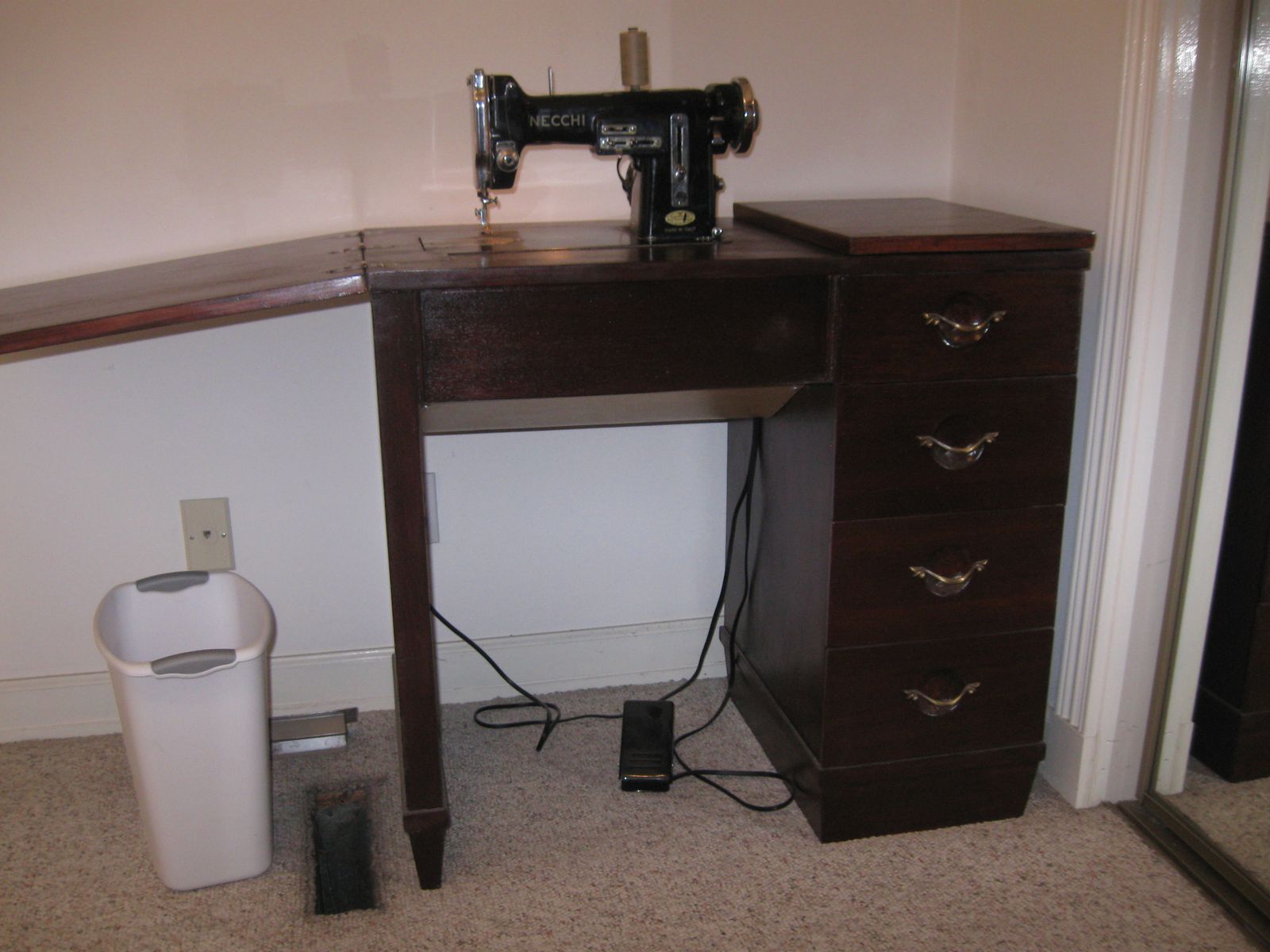 Necchi sewing machine in cabinet