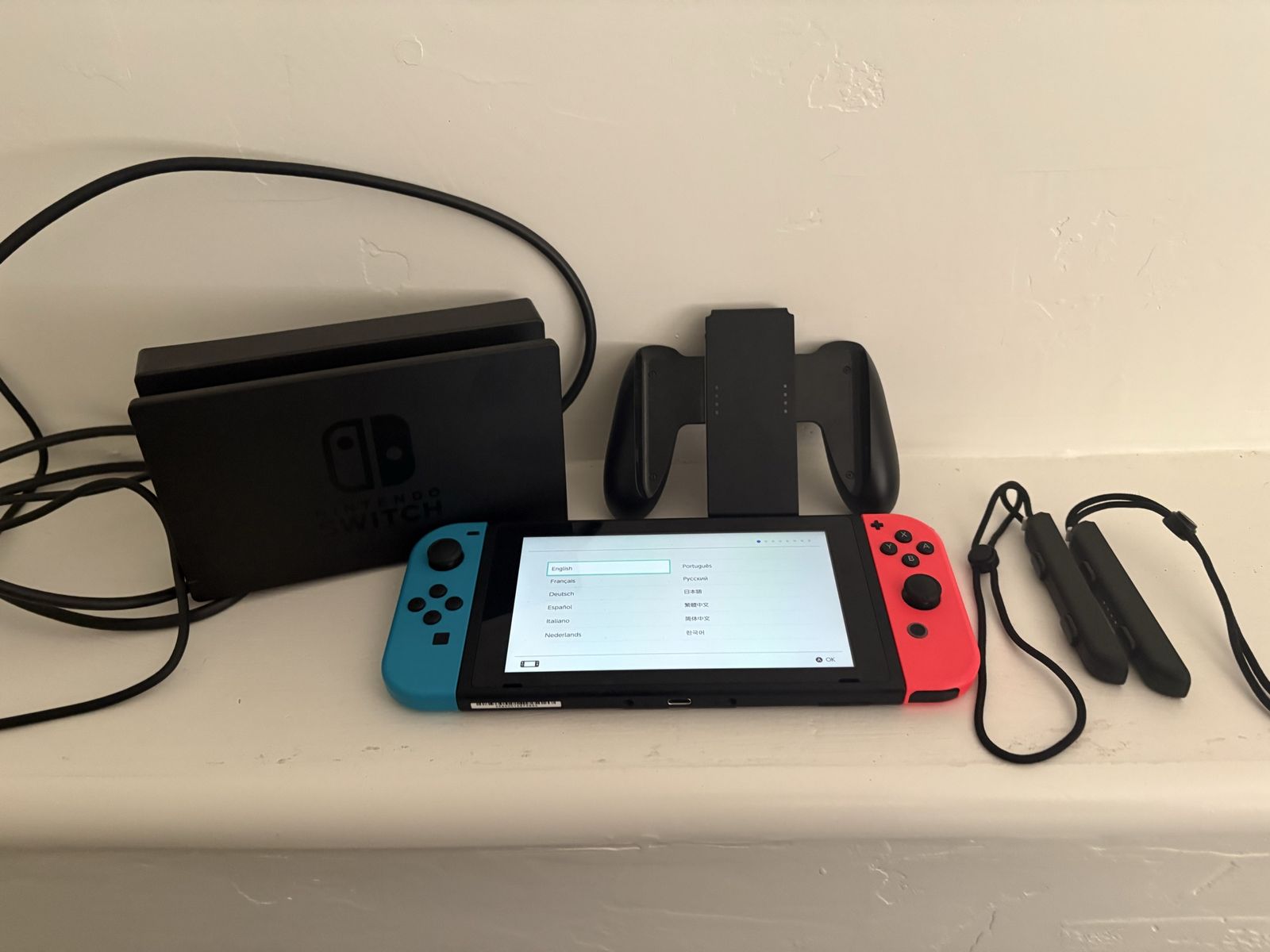 Nintendo Switch Console with Neon Red & Blue Joy-Cons, Dock, and Joy-Con Grip