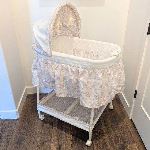 Delta Children Baby Bassinet with Adjustable Canopy, Music, Light & Motion Control