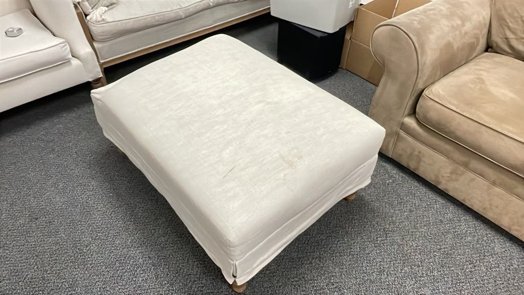 Upholstered Ottoman Footstool with Beige Fabric and Wooden Turned Legs