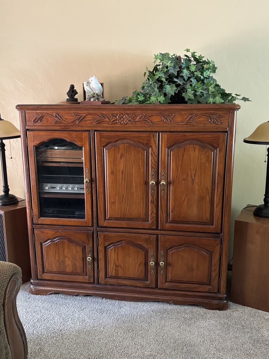 Vintage Wooden Entertainment Center Armoire with Glass Cabinet Door and Floral Carvings