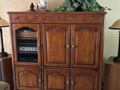Vintage Wooden Entertainment Center Armoire with Glass Cabinet Door and Floral Carvings