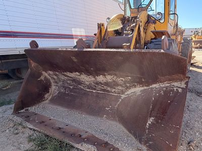 Cat 950 Loader with side dump trench bucket