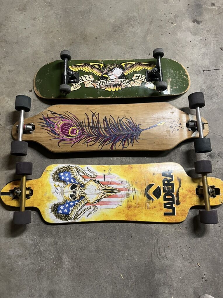 Two Long boards And One Skateboard