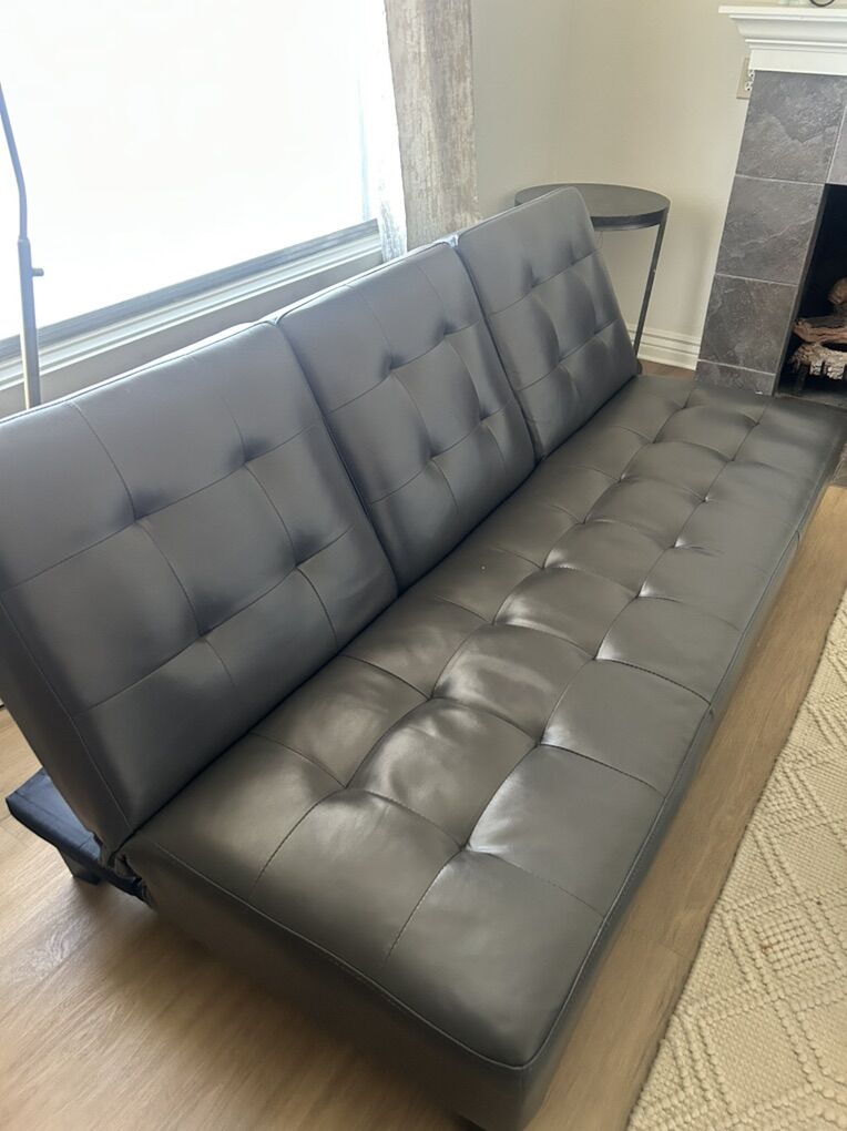 FUTON WITH DRINK AND FOOD TRAY IN MIDDLE