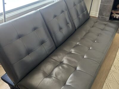 FUTON WITH DRINK AND FOOD TRAY IN MIDDLE