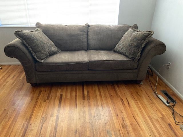 Fluffy, Overstuffed Olive Green Sofa, very good condition.
