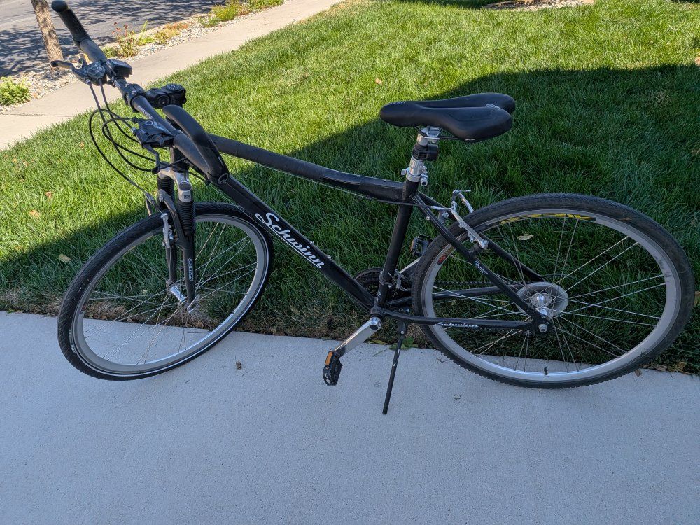 Schwinn Black Hybrid Commuter Bicycle with Front Suspension and Adjustable Handlebars