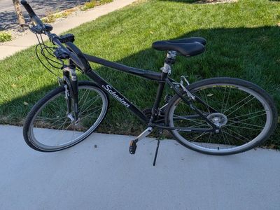 Schwinn Black Hybrid Commuter Bicycle with Front Suspension and Adjustable Handlebars