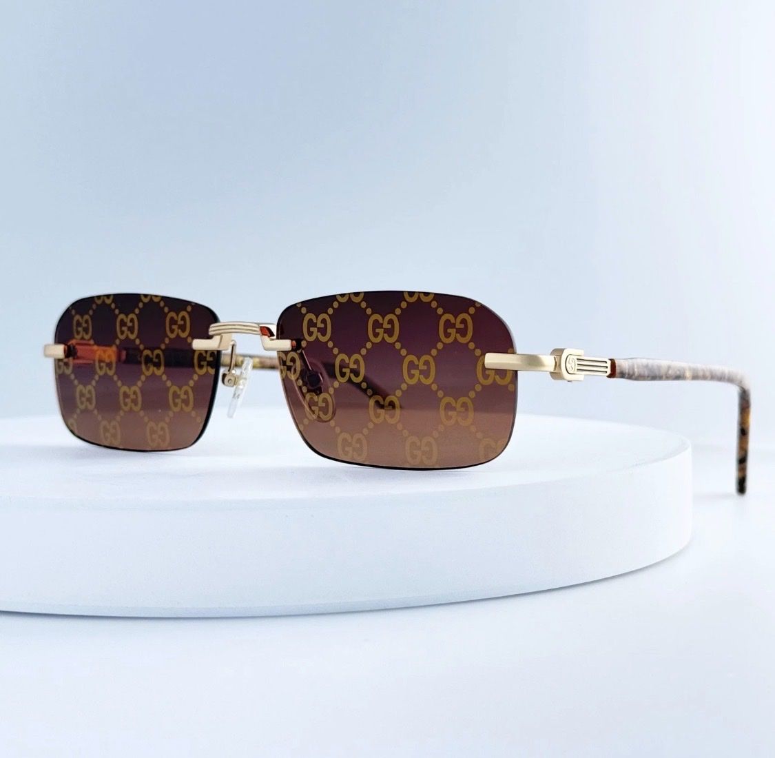 Gucci GG1221S 004 Rimless Sunglasses Gold Brown Marble Red Gold Mirror Lens