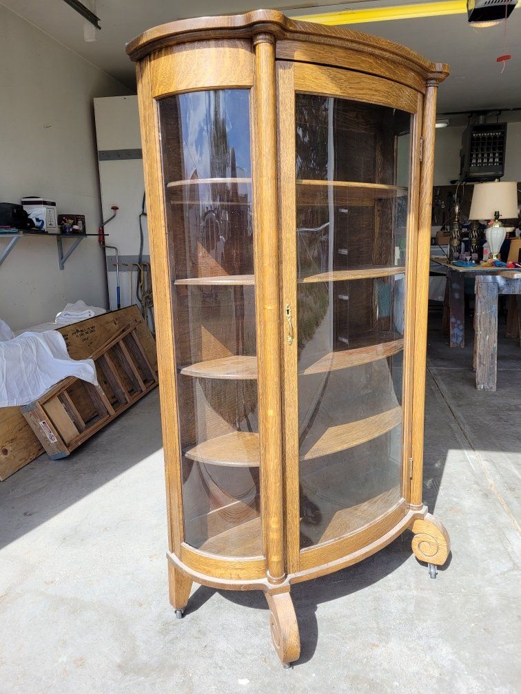 Antique glass curio cabinet