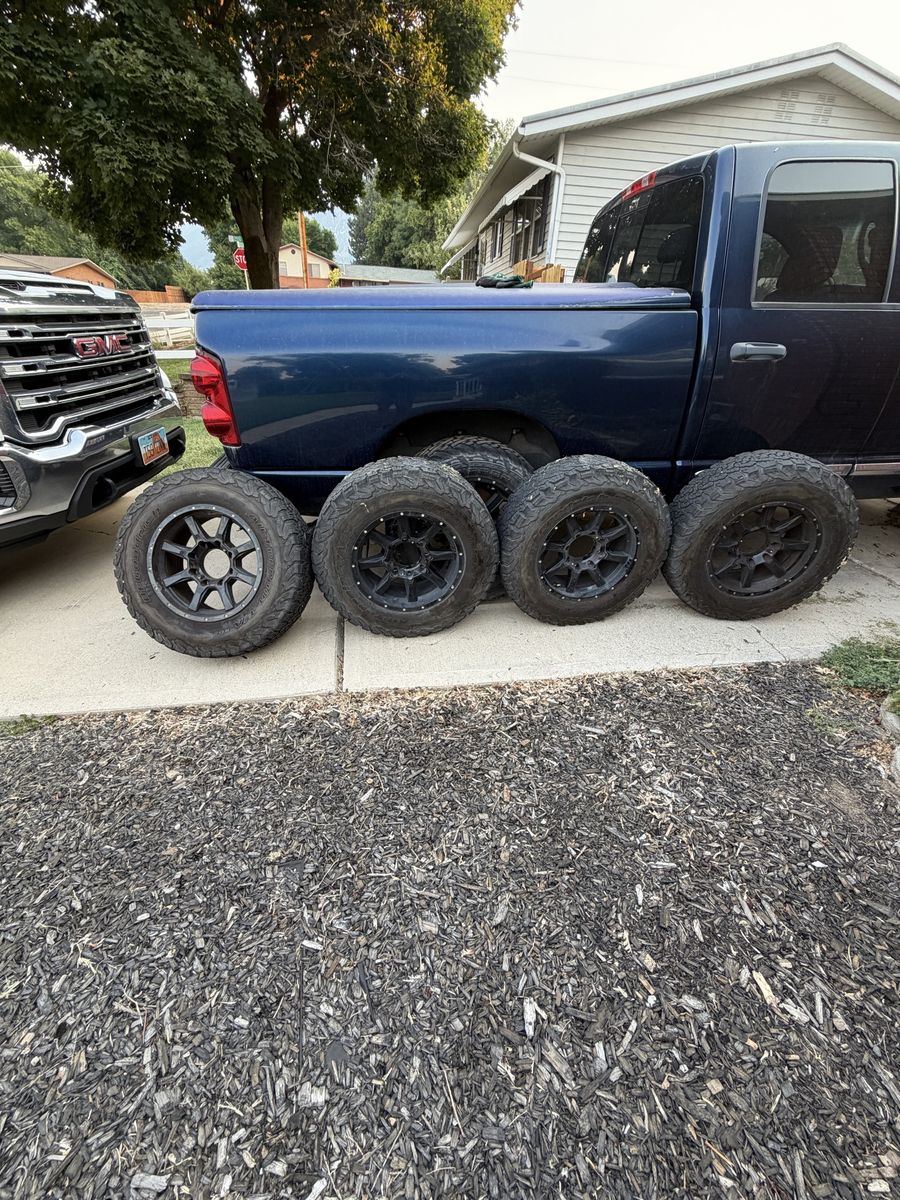 Set of 4 BFGoodrich All-Terrain T/A KO2 Tires LT245/75R17 on Black Off-Road Wheels