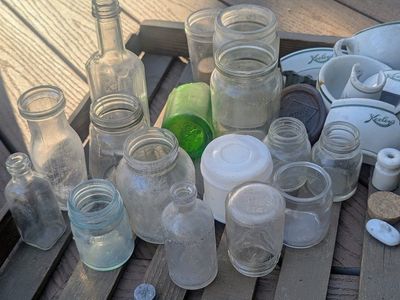 Antique bottles, oil can pump, light shade, pulleys, door pull handle, etc.