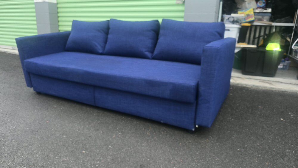 IKEA Futon pull out sofa, medium blue. 9 mo. old.