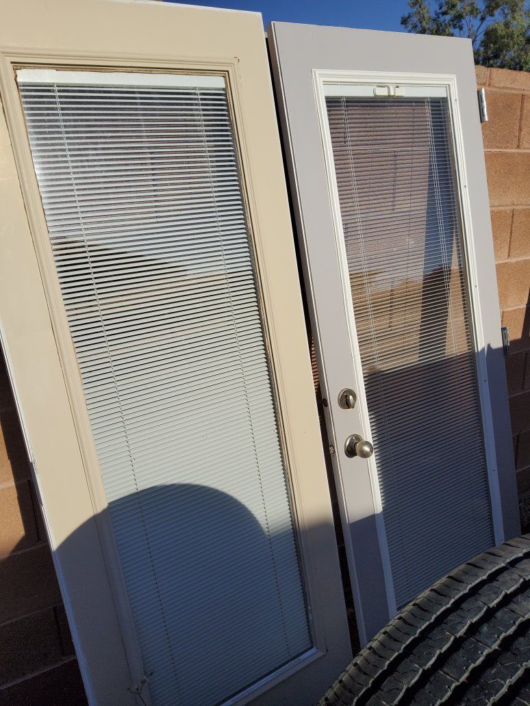 A Door And Sidelight With Blinds
