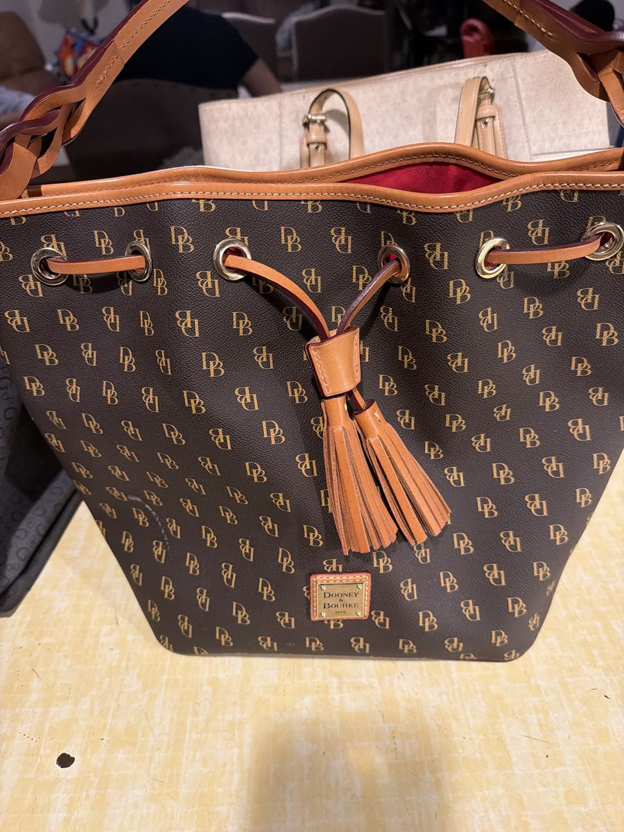 Dooney & Bourke Monogram DB Print Bucket Bag Purse with Tassels