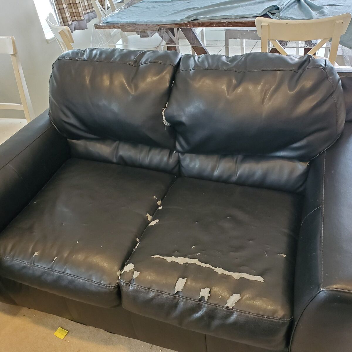 Black faux leather love seat