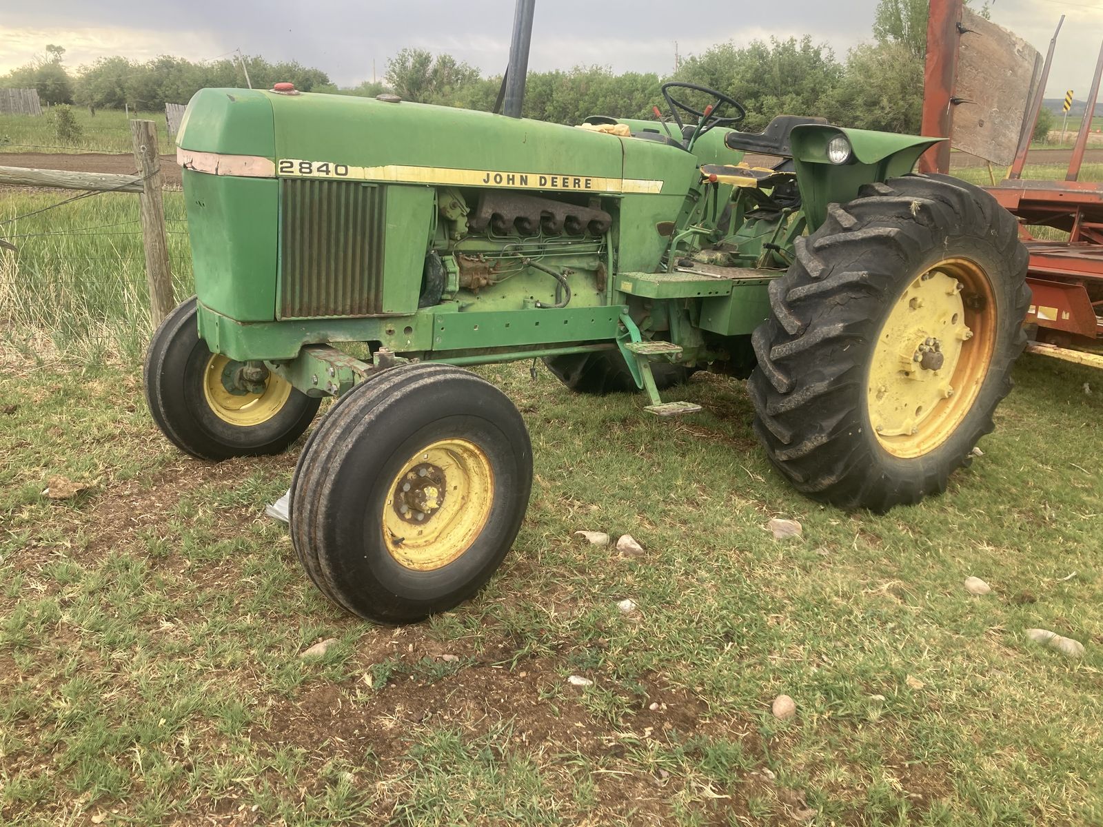 John deer 2840 and a new Hollander 1033 bale wagon