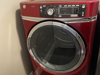 GE Ruby Red Electric Front-Load Dryer - RightHeight Pedestal Design