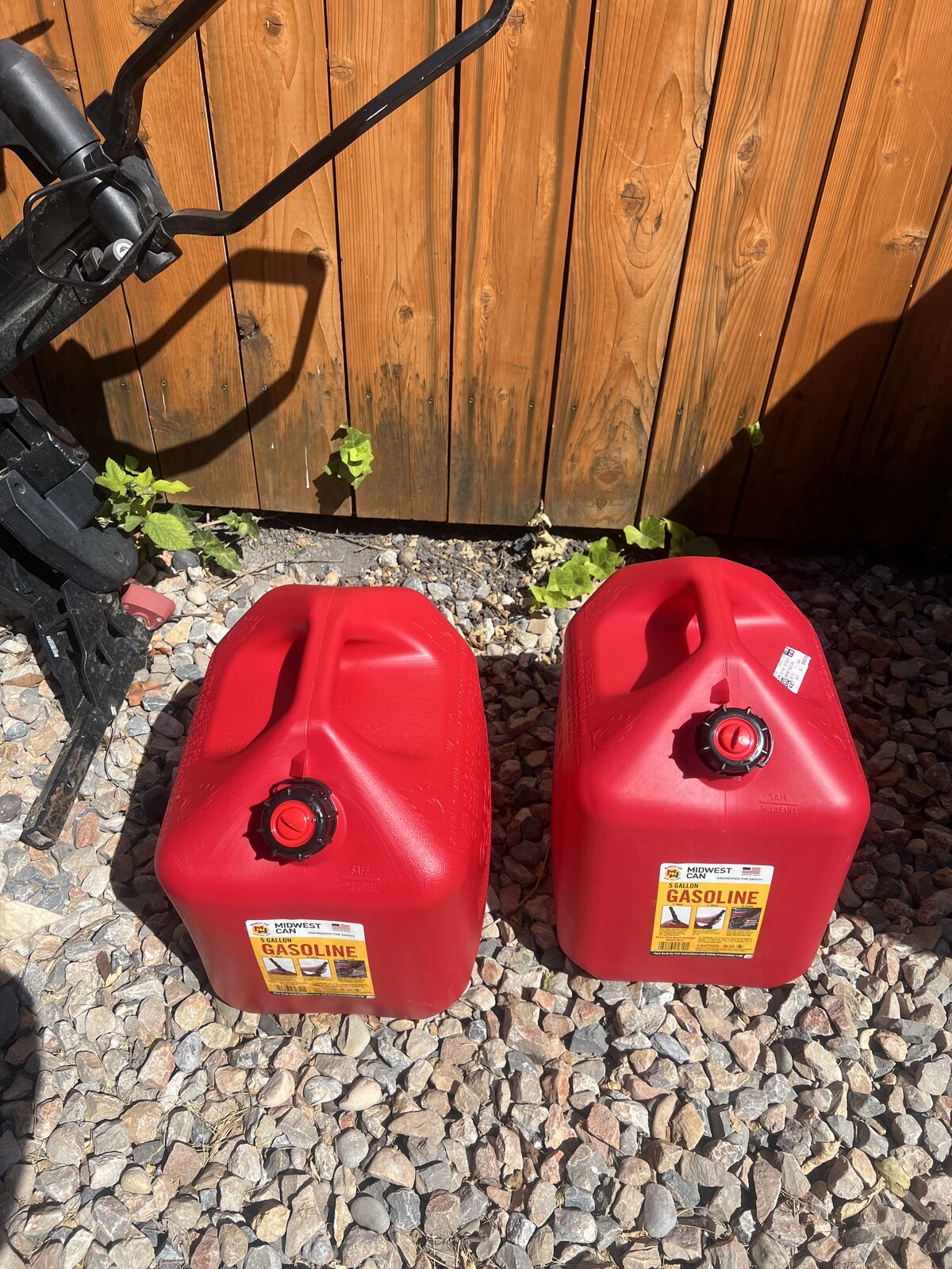 Two 5-gallon gas containers