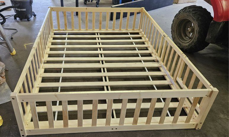 Full size wood floor bed frame.