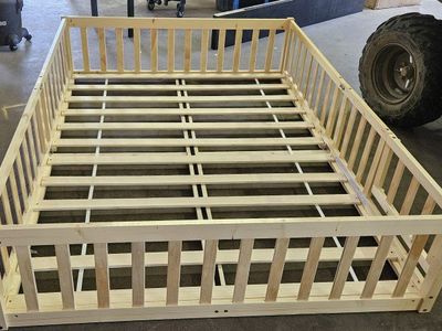 Full size wood floor bed frame.