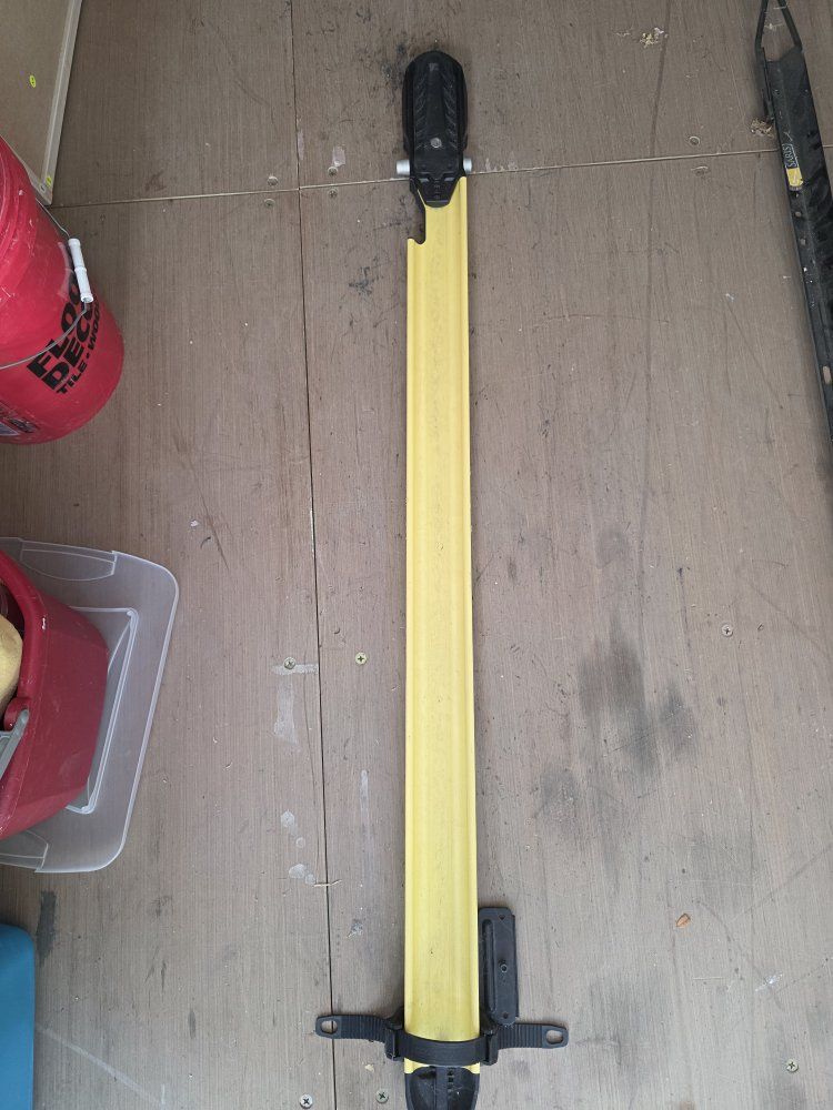 Yellow rocky mount Roof Mounted Bike Rack Tray with Integrated Cable Lock