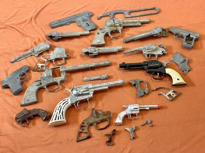 Collection Of Vintage Toy Guns In Various Stages