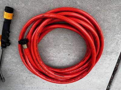 RV black water hose with clean out wand and storage bag