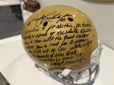 Autographed Rudy Ruettiger Notre Dame Gold Football Helmet with Full Speech Inscription