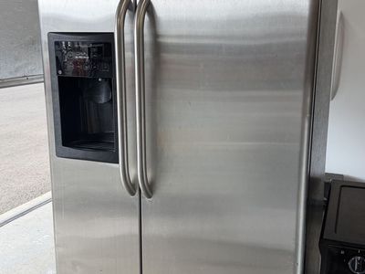 GE Stainless Steel Side-by-Side Refrigerator with Ice And Water Dispenser