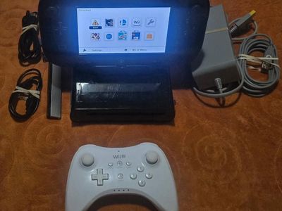 Nintendo Wii U Deluxe with 7 gaames including Zelda Twilight Princess Hd! trades considered!