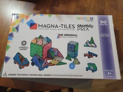Magna-Tiles Grand Prix Frost Colors 50-Piece Magnetic Building Set with 2 Wheeled Chassis. Missing one piece.