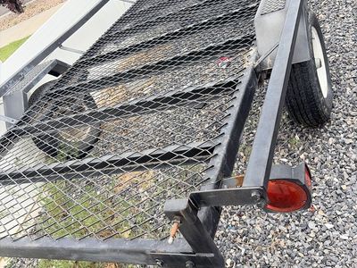 DualLid Heavy-Duty Utility Trailer with Storage Box - Perfect for Hauling and Tools