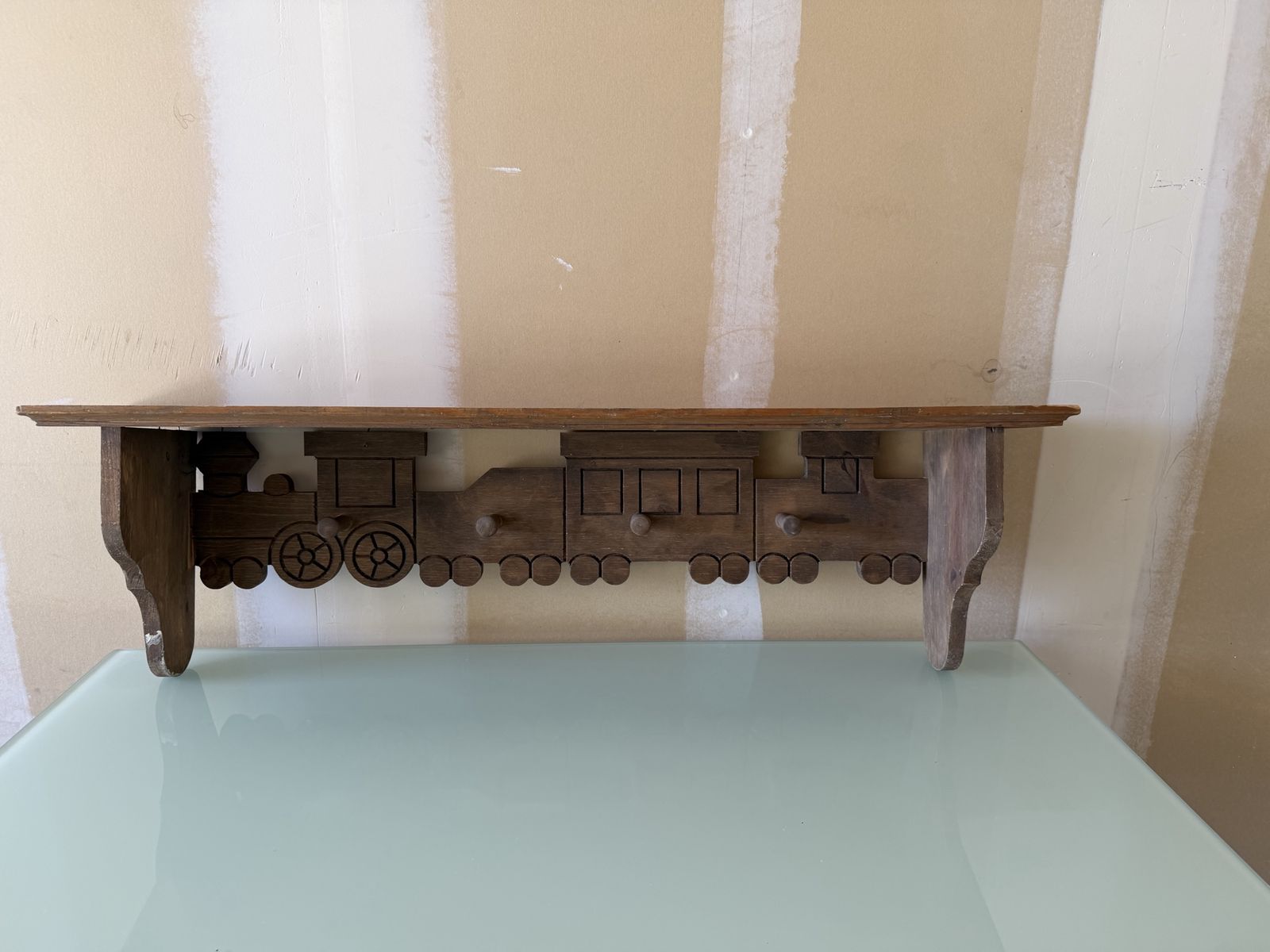 vintage and handmade wooden train wall shelves with pegs