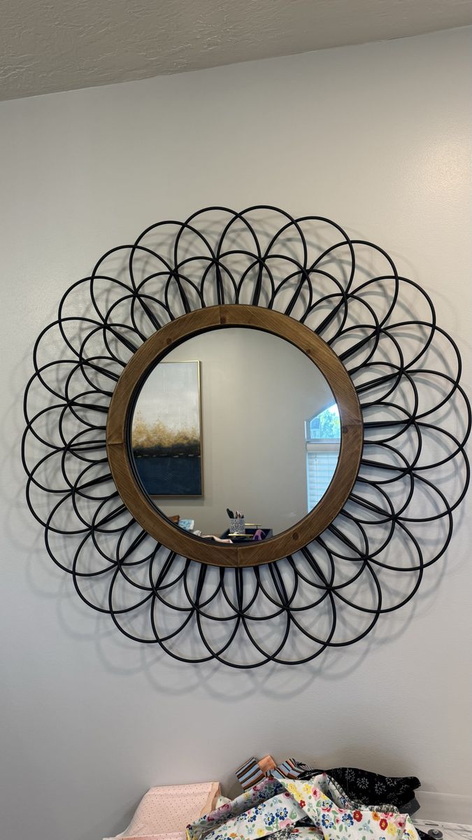 Beautiful wood and rod iron mirror.