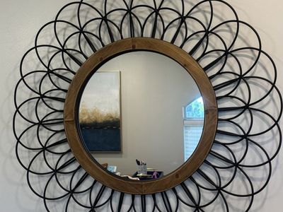 Beautiful wood and rod iron mirror.