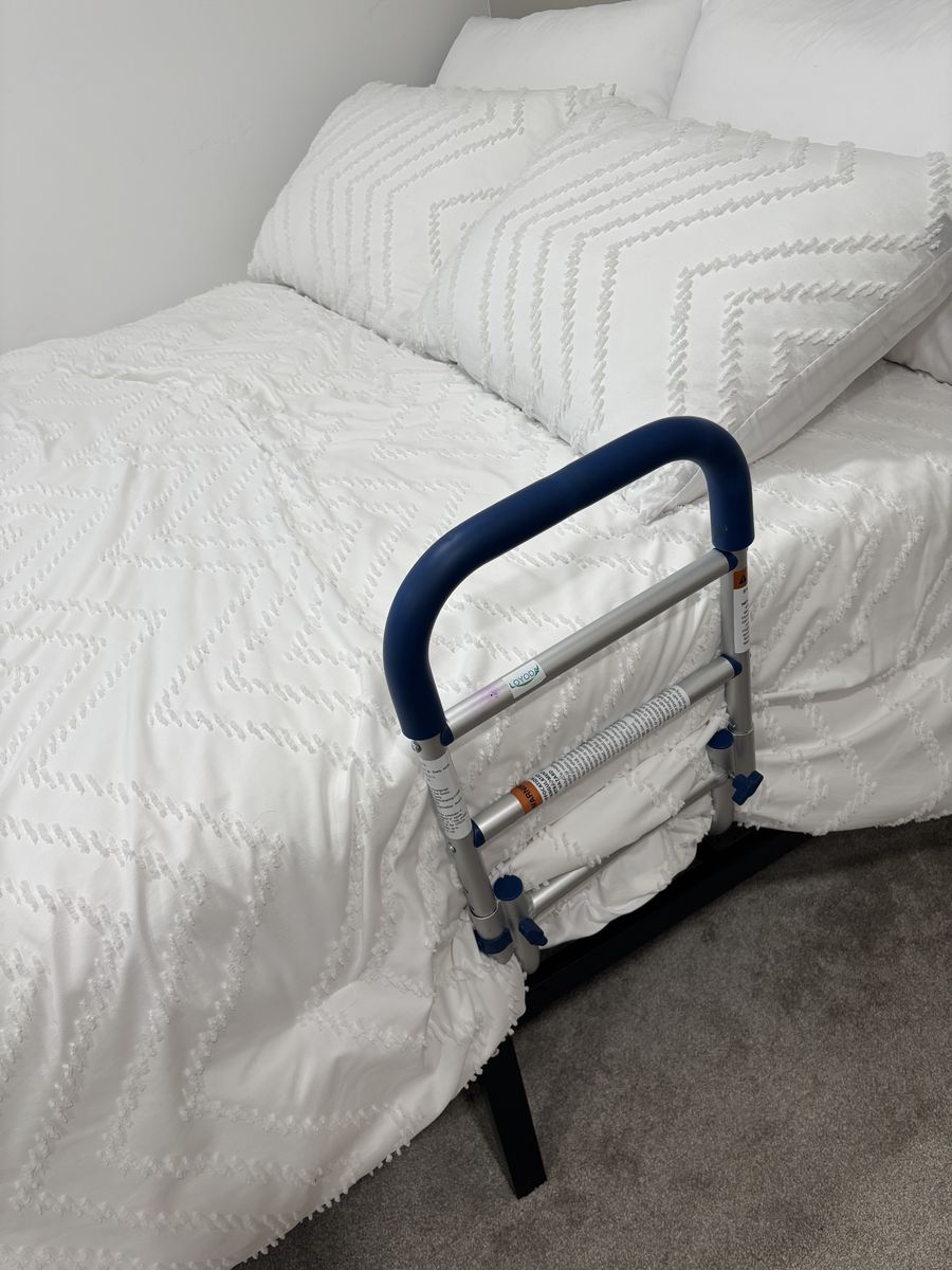 Adjustable bed rail/handle