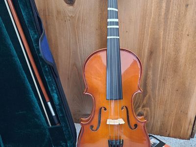 Violin with: book, rosin and a shoulder rest