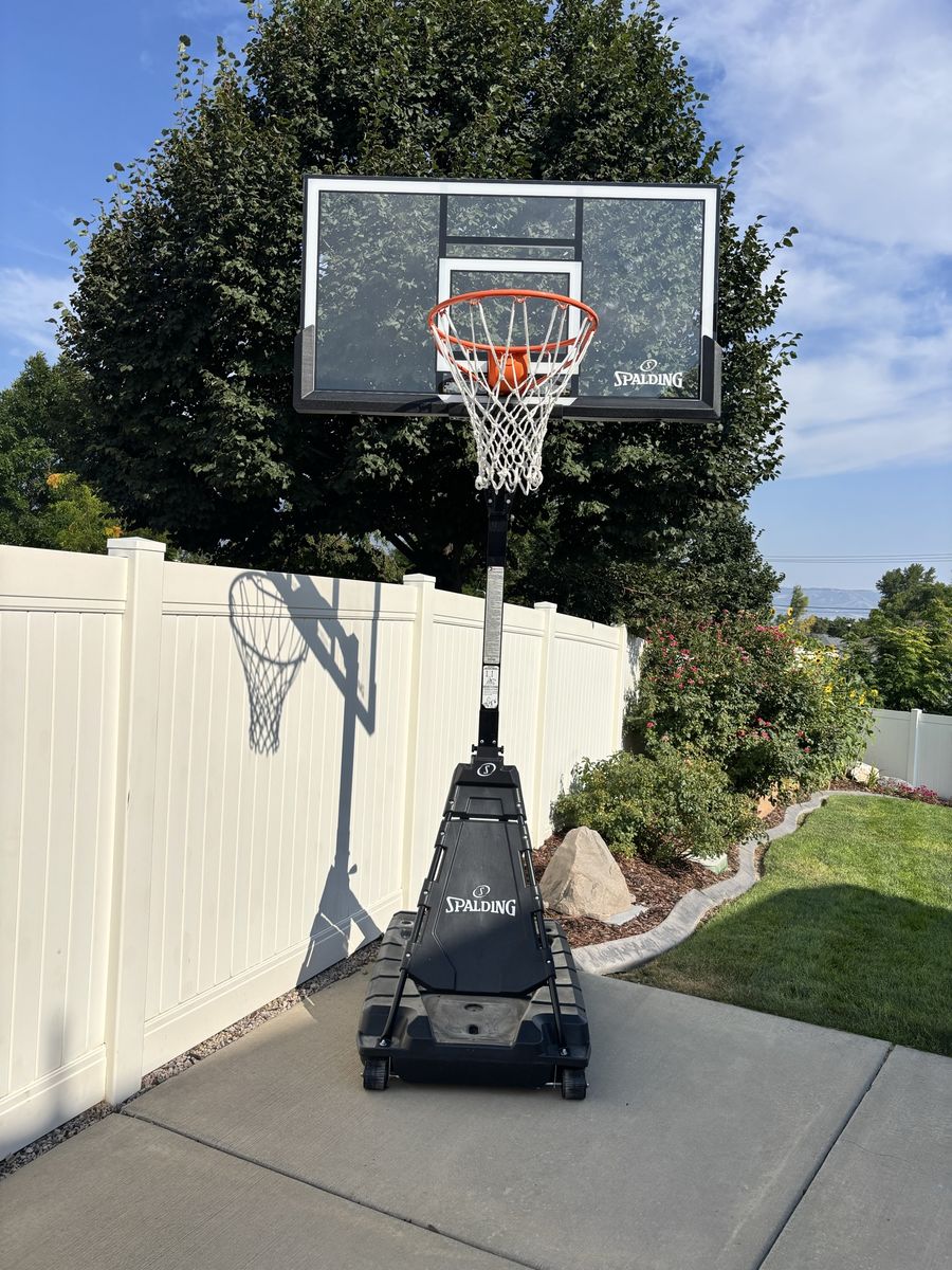 Like New! Spalding 54” Portable Basketball Hoop System with Glass/Acrylic Backboard
