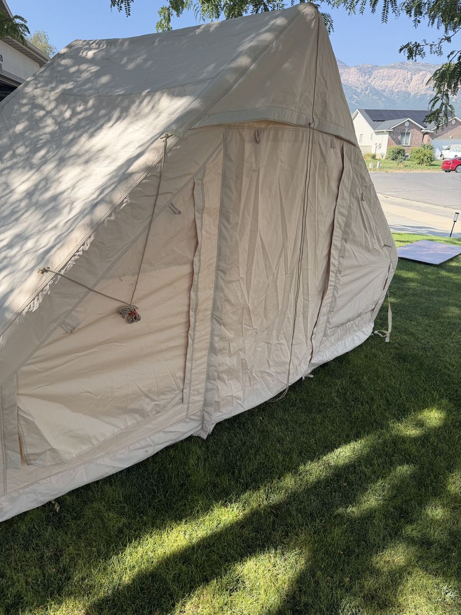 Inflatable tent and queen size mattress that goes inside